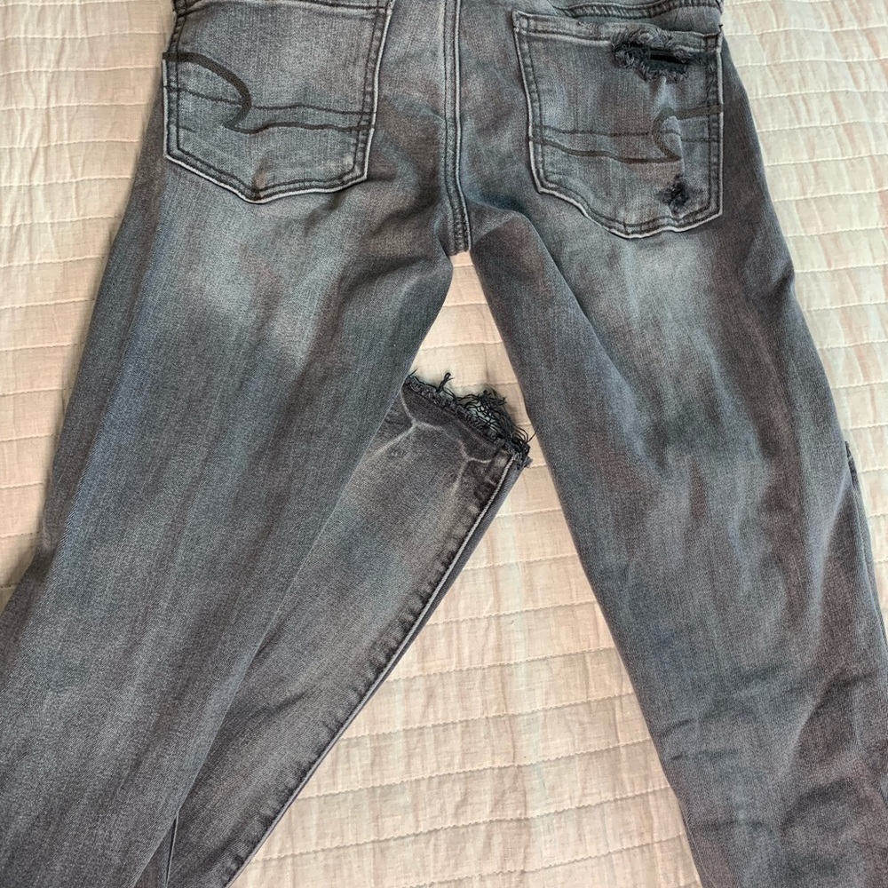 AEO Super Stretch faded grey pants with tears